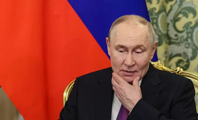 Russian President Vladimir Putin listens to Syrian interim President Ahmad al-Sharaa during their meeting at the Grand Kremlin Palace in Moscow, on Wednesday, Jan. 28, 2026. (Maxim Shipenkov/Pool Photo via AP)