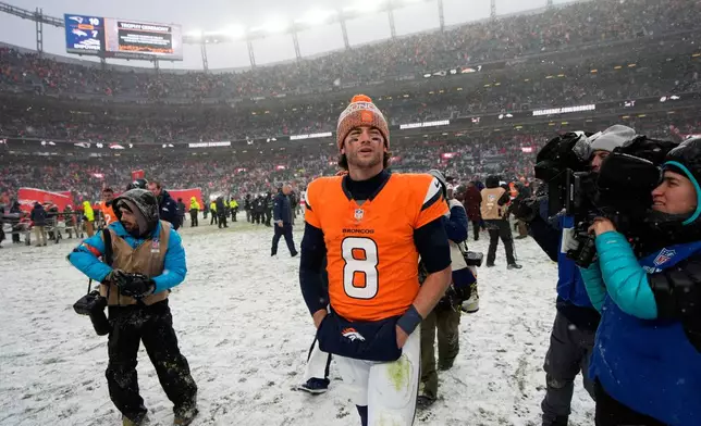Denver Broncos quarterback Jarrett Stidham leaves the field after the AFC Championship NFL football game between the Denver Broncos and the New England Patriots, Sunday, Jan. 25, 2026, in Denver. (AP Photo/John Locher)