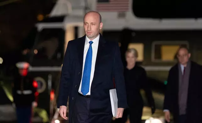 White House deputy chief of policy Stephen Miller walks from Marine One after arriving on the South Lawn of the White House, Tuesday, Jan. 27, 2026, in Washington. (AP Photo/Alex Brandon)