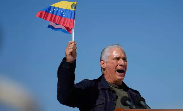 Cuban President Miguel Diaz-Canel attends a rally in Havana, Cuba, Saturday, Jan. 3, 2026, in solidarity with Venezuela after the U.S. captured President Nicolas Maduro and flew him out of Venezuela. (AP Photo/Ramon Espinosa)