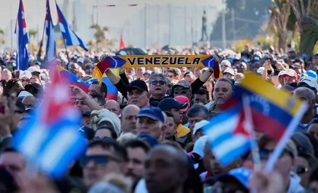 Cubans attends a rally in Havana, Saturday, Jan. 3, 2026, in solidarity with Venezuela after the U.S. captured President Nicolas Maduro and flew him out of Venezuela. (AP Photo/Ramon Espinosa)
