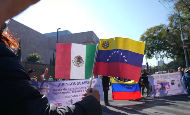 People protest outside the U.S. Embassy against the capture of President Nicolas Maduro, in Mexico City, Saturday, Jan. 3, 2026. (AP Photo/Marco Ugarte)
