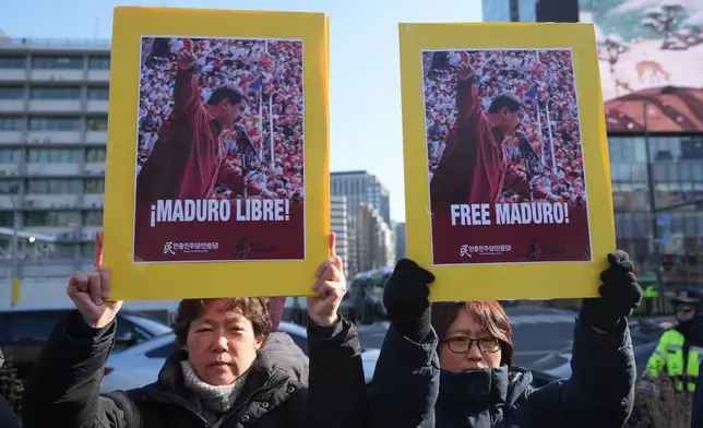 Protesters hold posters during a rally denouncing the U.S. government and President Donald Trump after the U.S. captured Venezuelan President Nicolás Maduro, near the U.S. Embassy in Seoul, South Korea, Monday, Jan. 5, 2026. (AP Photo/Lee Jin-man)