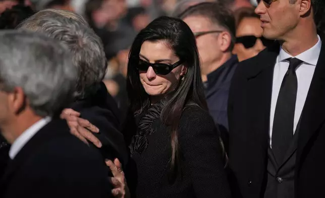 Anne Hathaway leaves after attending the funeral of fashion designer Valentino Garavani at the St. Mary of Angels Basilica, in Rome, Friday, Jan. 23, 2026. (AP Photo/Andrew Medichini)