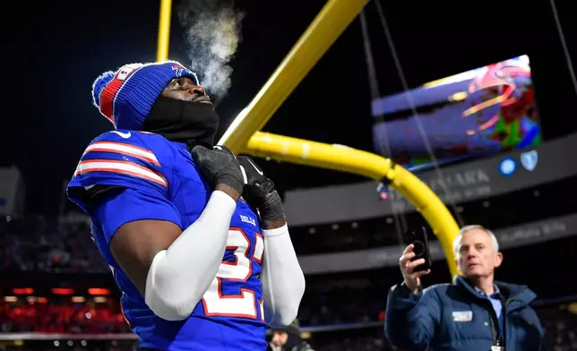 Buffalo Bills cornerback Tre'Davious White (27) remains on the field to watch a tribute video after the Bills beat the New York Jets in the Bills' final regular-season NFL football home game in Highmark Stadium Sunday, Jan. 4, 2026, in Orchard Park, N.Y.(AP Photo/Adrian Kraus)