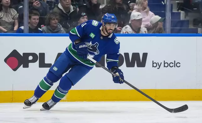 Vancouver Canucks' Evander Kane skates during the second period of an NHL hockey game against the San Jose Sharks in Vancouver, British Columbia, Tuesday, Jan. 27, 2026. (Darryl Dyck/The Canadian Press via AP)