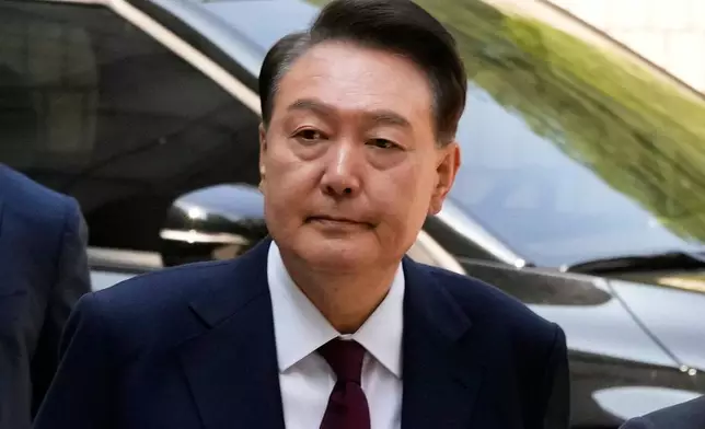 FILE - Then South Korea's ousted former President Yoon Suk Yeol who is facing charges of orchestrating a rebellion when he declared martial law on Dec. 3, arrives to attend his trial at the Seoul Central District Court in Seoul, South Korea, Monday, May 12, 2025. (AP Photo/Ahn Young-joon, Pool, File)