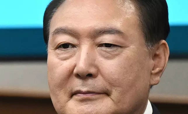 FILE - Then South Korea's ousted President Yoon Suk Yeol, who is facing charges of orchestrating a rebellion when he declared martial law on Dec. 3, attends his criminal trial at a courtroom of the Seoul Central District Court in Seoul Monday, April 21, 2025. (Jung Yeon-je/Pool Photo via AP, File)