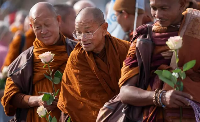 Buddhist monks participate in the, "Walk For Peace," Thursday, Jan. 8, 2026, in Saluda, S.C. (AP Photo/Allison Joyce)