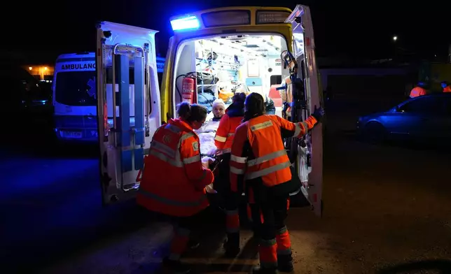 An injured person is transported by ambulance in Adamuz, near Córdoba, southern Spain, Monday, Jan. 19, 2026, after a high-speed train derailed and collided with another train. (Francisco J. Olmo/Europa Press via AP)