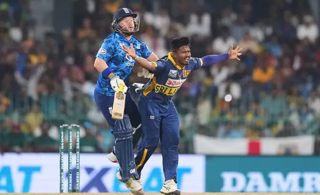 England's Ben Duckett collides with Sri Lanka's Pramod Madushan during the second ODI cricket match between England and Sri Lanka in Colombo, Sri Lanka, Saturday, Jan, 24, 2026. (AP Photo/Eranga Jayawardena)