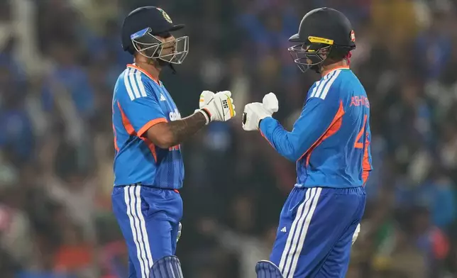India's captain Suryakumar Yadav, left, and batting partner Abhishek Sharma encourage each other during the first T20 cricket match between India and New Zealand in Nagpur, India, Wednesday, Jan. 21, 2026. (AP Photo/Mahesh Kumar A.)