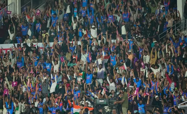 Indian fans cheer for their team during the first T20 cricket match between India and New Zealand in Nagpur, India, Wednesday, Jan. 21, 2026. (AP Photo/Mahesh Kumar A.)