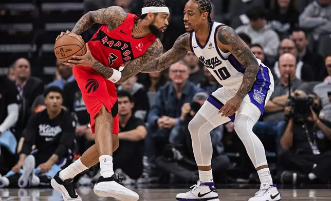 Toronto Raptors forward Brandon Ingram (3) is defended by Sacramento Kings guard DeMar DeRozan (10) during the first half of an NBA basketball game, Wednesday, Jan. 21, 2026, in Sacramento, Calif. (AP Photo/Justine Willard)