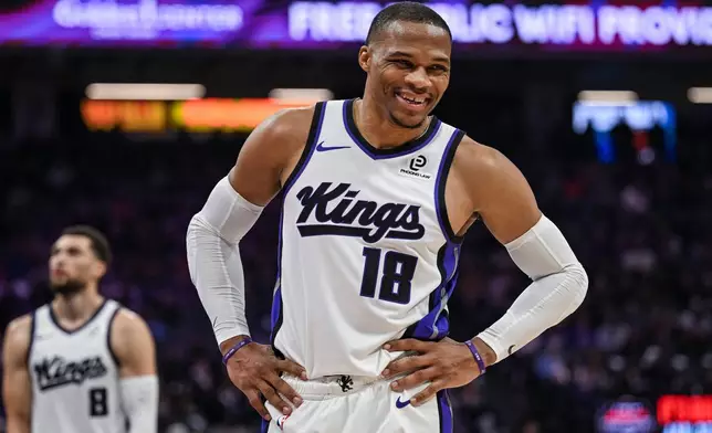 Sacramento Kings guard Russell Westbrook (18) smiles during the first half of an NBA basketball game against the Toronto Raptors, Wednesday, Jan. 21, 2026, in Sacramento, Calif. (AP Photo/Justine Willard)