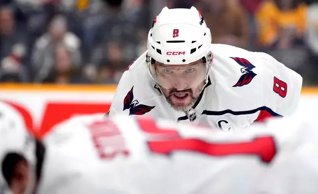 Washington Capitals left wing Alex Ovechkin (8) waits for the puck to be dropped during a face-off in the first period of an NHL hockey game against the Nashville Predators, Sunday, Jan. 11, 2026, in Nashville, Tenn. (AP Photo/Mark Humphrey)