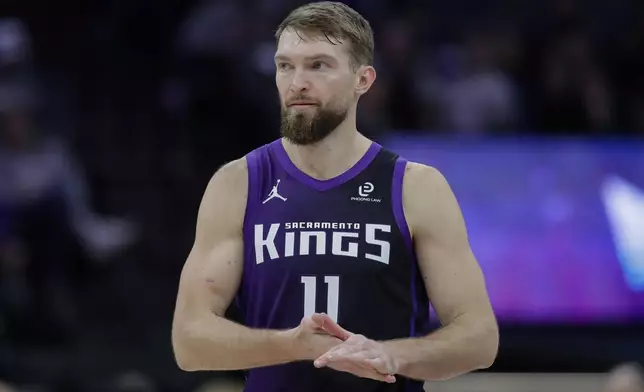Sacramento Kings forward Domantas Sabonis looks on during the first half of an NBA basketball game against the Washington Wizards, Friday, Jan. 16, 2026, in Sacramento, Calif. (AP Photo/Scott Marshall)