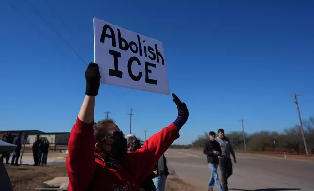 Protesters gather outside the South Texas Family Residential Center detention facility where Liam Ramos and his father are being detained in Dilley, Texas, Wednesday, Jan. 28, 2026. (AP Photo/Eric Gay)