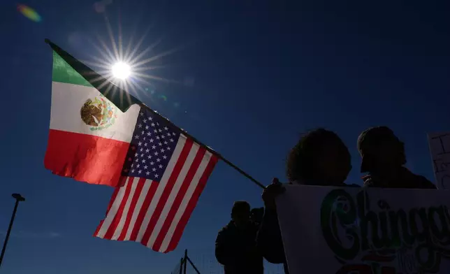 Protesters gather outside the South Texas Family Residential Center detention facility where Liam Ramos and his father are being detained in Dilley, Texas, Wednesday, Jan. 28, 2026. (AP Photo/Eric Gay)