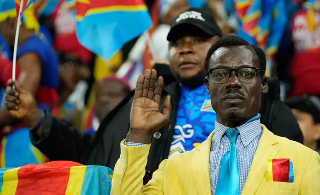 A DR Congo fans cheer prior to the Africa Cup of Nations group D soccer match between Botswana and DR Congo in Rabat, Morocco, Tuesday, Dec. 30, 2025. (AP Photo/Mosa'ab Elshamy)