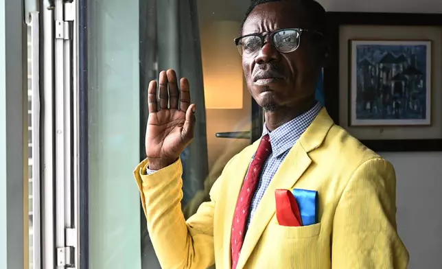 Nkuka Mboladinga, also known as Lumumba Vea, speaks to Associated Press in Casablanca, Morocco, Saturday, Jan. 3, 2026. (AP Photo/Samy Ntumba Shambuyi)