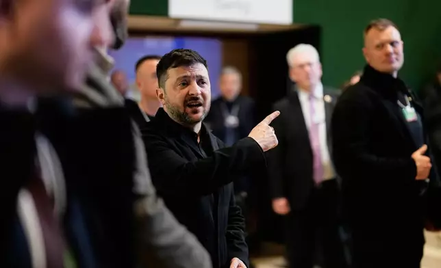Ukraine's President Volodymyr Zelenskyy talks to the media at the Annual Meeting of the World Economic Forum in Davos, Switzerland, Thursday, Jan. 22, 2026. (AP Photo/Markus Schreiber)