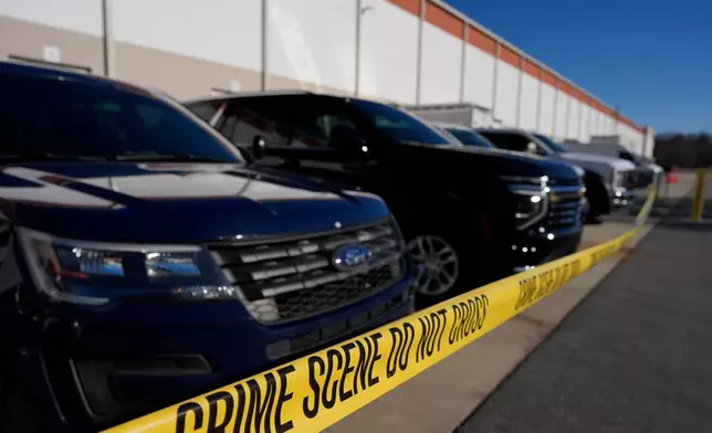 A crime scene tape is seen as FBI agents search at the Fulton County Election Hub and Operation Center, Wednesday, Jan. 28, 2026, in Union City, Ga, near Atlanta. (AP Photo/Mike Stewart)