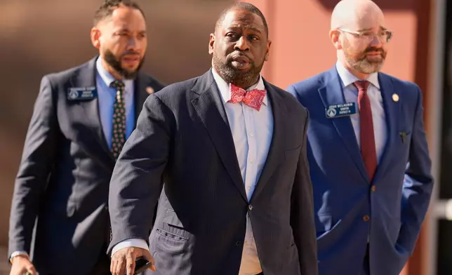 Fulton County Commissioner Marvin S. Arrington, Jr., walks with other elected officials, Wednesday, Jan. 28, 2026, in Union City, Ga., near Atlanta, as FBI agents search at the Fulton County Election Hub and Operation Center. (AP Photo/Mike Stewart)