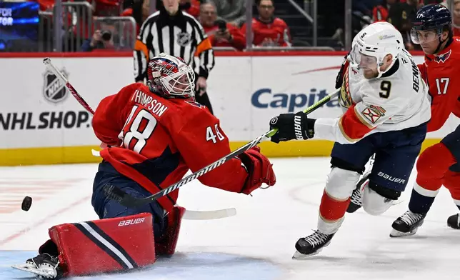 Florida Panthers center Sam Bennett (9) shoots the puck past Washington Capitals goaltender Logan Thompson for a goal during the second period of an NHL hockey game, Saturday, Jan. 17, 2026, in Washington. (AP Photo/John McDonnell)