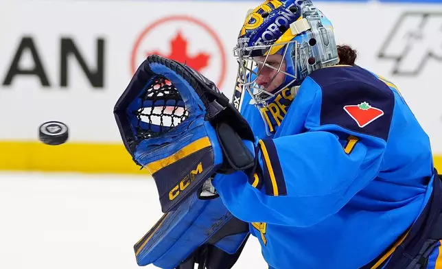 Toronto Sceptres goaltender Raygan Kirk makes a save during third-period PWHL hockey game action against the Vancouver Goldeneyes in Toronto, Saturday, Jan. 17, 2026. (Frank Gunn/The Canadian Press via AP)
