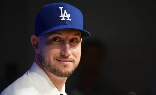 Outfielder Kyle Tucker looks on during a news conference after joining the Los Angeles Dodgers baseball team, Wednesday, Jan. 21, 2026, in Los Angeles. (AP Photo/Damian Dovarganes)