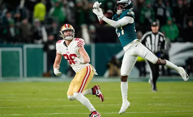 Philadelphia Eagles cornerback Quinyon Mitchell (27) intercepts a pass intended for San Francisco 49ers tight end Jake Tonges (88) during the second half of an NFL wild-card playoff football game Sunday, Jan. 11, 2026, in Philadelphia. (AP Photo/Chris Szagola)