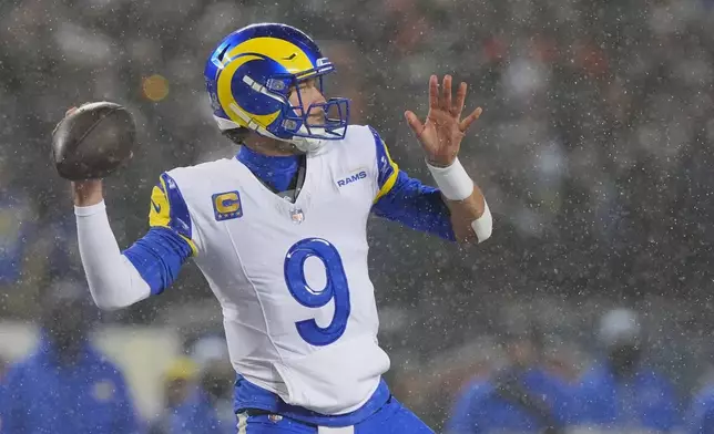 Los Angeles Rams quarterback Matthew Stafford throws a pass against the Chicago Bears during the first half of an NFL football divisional playoff game Sunday, Jan. 18, 2026, in Chicago. (AP Photo/Nam Y. Huh)