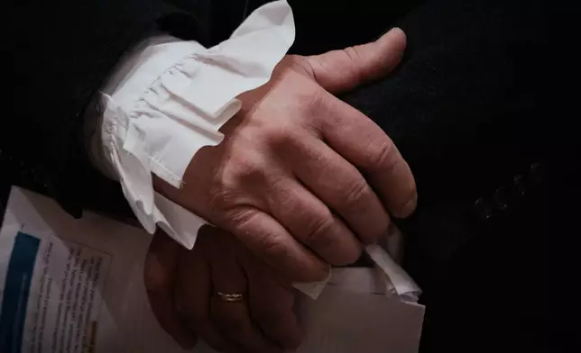 A man prepares to orates selected readings from Thomas Paine's Common Sense during an event commemorating the 250th anniversary of the pamphlet's publication at the Fraunces Tavern Museum on Saturday, Jan. 10, 2026, in New York. (AP Photo/Andres Kudacki)