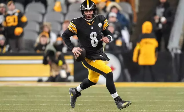 Pittsburgh Steelers quarterback Aaron Rodgers (8) runs with the ball during the first half of an NFL football game against the Baltimore Ravens, Sunday, Jan. 4, 2026, in Pittsburgh. (AP Photo/Gene J. Puskar)