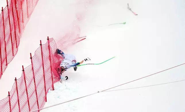 Norway's Marte Monsen crashes during an alpine ski, women's World Cup downhill, in Crans Montana , Switzerland, Friday, Jan. 30, 2026. (AP Photo/Giovanni Auletta)