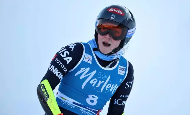 United States' Mikaela Shiffrin checks her time at the finish area of a women's World Cup giant slalom, in Kronplatz, Italy, Tuesday, Jan. 20, 2026. (AP Photo/Marco Trovati)