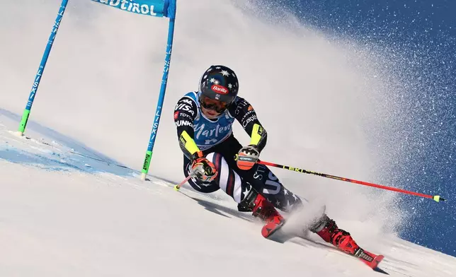 United States' Mikaela Shiffrin speeds down the course during a women's World Cup giant slalom, in Kronplatz, Tuesday, Jan. 20, 2026. (AP Photo/Marco Trovati)