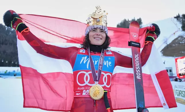 Austria's Julia Scheib celebrates winning an alpine ski women's World Cup giant slalom, in Kronplatz, Italy, Tuesday, Jan. 20, 2026. (AP Photo/Marco Trovati)