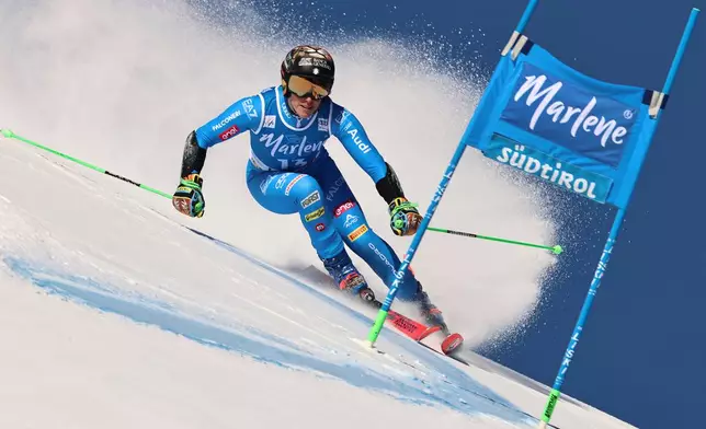 Italy's Federica Brignone speeds down the course during a women's World Cup giant slalom, in Kronplatz, Tuesday, Jan. 20, 2026. (AP Photo/Marco Trovati)