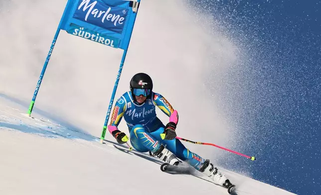 Sweden's Sara Hector speeds down the course during a women's World Cup giant slalom, in Kronplatz, Tuesday, Jan. 20, 2026. (AP Photo/Marco Trovati)