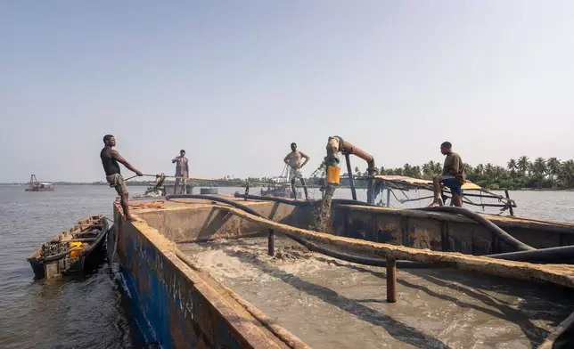 Sand extraction in progress on Lagos waters, Saturday, Dec. 6, 2025. (AP Photo/Grace Ekpu)