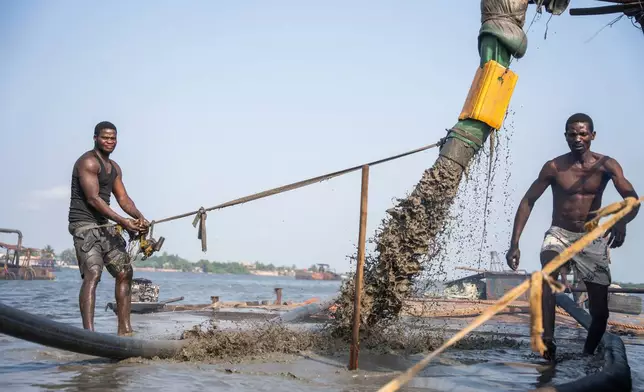 Sand extraction in progress in Lagos waters, Saturday, Dec. 6, 2025. (AP Photo/Grace Ekpu)