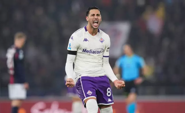 Fiorentina's Rolando Mandragora celebrates after scoring during the Serie A soccer match between Bologna and Fiorentina, in Bologna, Italy, Sunday, Jan. 18, 2026. (Massimo Paolone/LaPresse via AP)