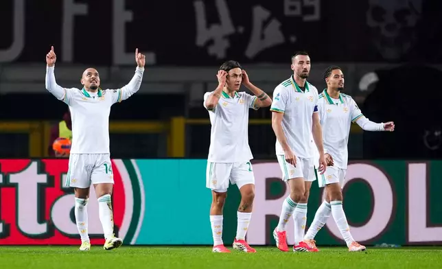 Roma's Donyell Malen, left, celebrates after scoring the opening goal during the Serie A soccer match between Torino and Roma in Turin, Italy, Jan. 18, 2026. (Fabio Ferrari/LaPresse via AP)