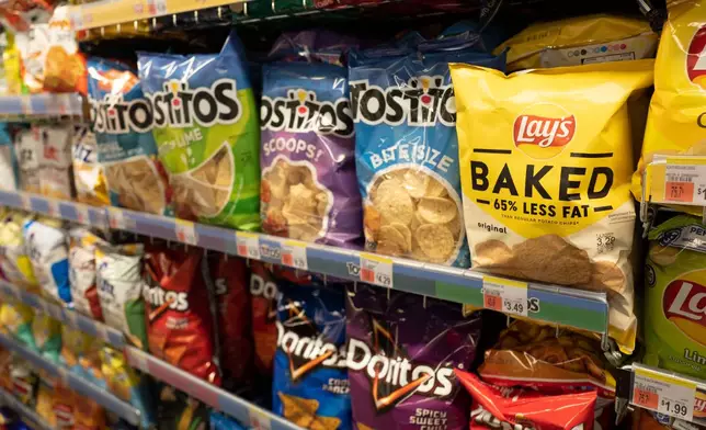 FILE - Potato chips are displayed in pharmacy Duane Reade by Walgreens, Thursday, March 25, 2021, in New York. Walgreens reports earnings March 31, 2021. (AP Photo/Mark Lennihan, file)
