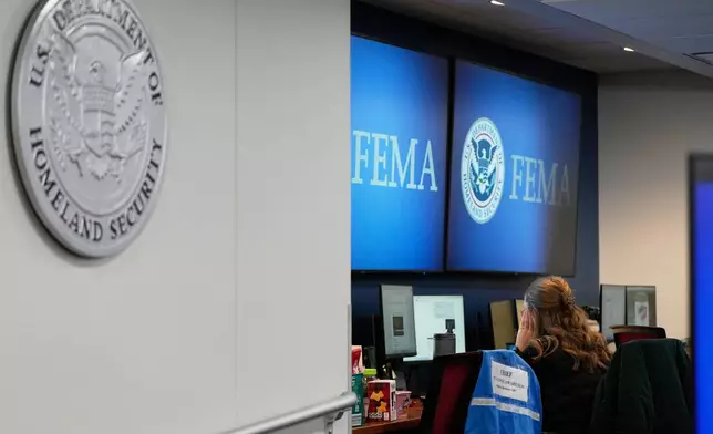 A person works at Federal Emergency Management Agency headquarters Saturday, Jan. 24, 2026, in Washington. (AP Photo/Julia Demaree Nikhinson)