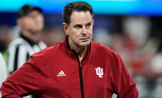 Indiana head coach Curt Cignetti walks on the field before the Peach Bowl NCAA college football playoff semifinal against Oregon, Friday, Jan. 9, 2026, in Atlanta. (AP Photo/Mike Stewart)
