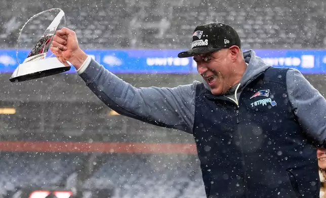 New England Patriots head coach Mike Vrabel celebrates with the trophy after the AFC Championship NFL football game between the Denver Broncos and the New England Patriots, Sunday, Jan. 25, 2026, in Denver. (AP Photo/John Locher)