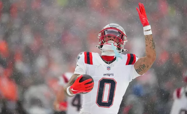 New England Patriots cornerback Christian Gonzalez celebrate after an interception against the Denver Broncos during the second the half of the AFC Championship NFL football game, Sunday, Jan. 25, 2026, in Denver. (AP Photo/Garrett W. Ellwood)